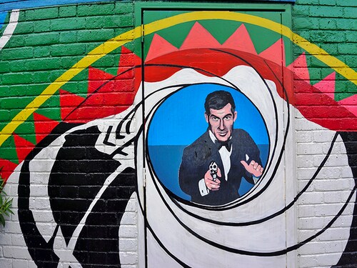LONDON, ENGLAND -12 MARCH 2015- Editorial: The Stockwell War Memorial Rotunda in London, painted in 1999 by artist Brian Barnes, includes an image of actor Roger Moore as James Bond 007.