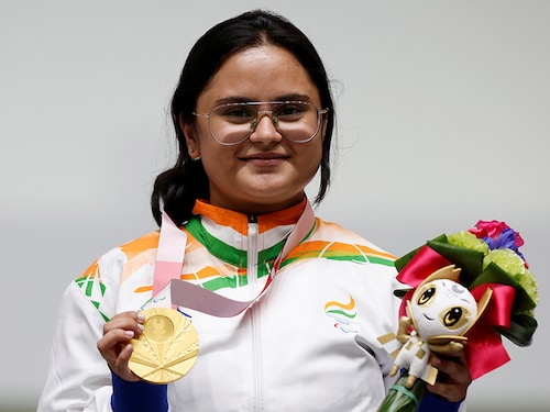 Tokyo 2020 Paralympic Games - Shooting - R2 - Women's 10m Air Rifle Standing SH1 - Medal Ceremony - Asaka Shooting Range, Tokyo, Japan - August 30, 2021. Gold Medallist Avani Lekhara of India celebrates on the podium REUTERS/Issei Kato - RC2FFP9B2YXB