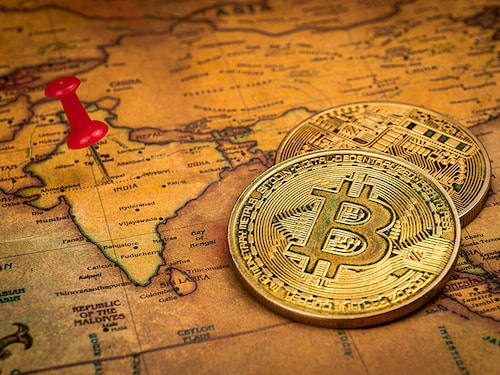 Red pin and bitcoin on India world map Investment in cryptocurrency concept Red pin and bitcoin on India world map Investment in cryptocurrency concept