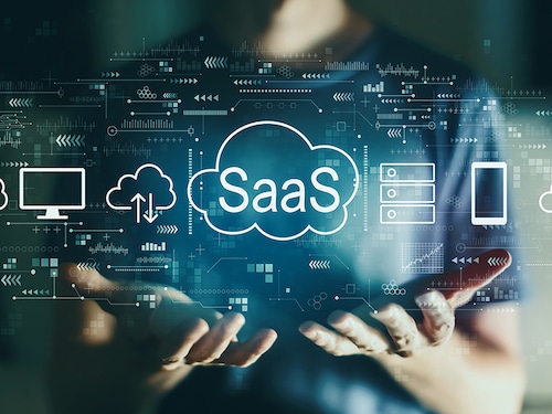 SaaS - software as a service concept with young man in the night