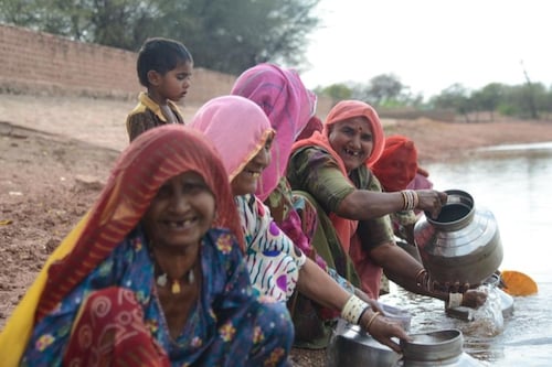Women celebrate as water is now closer to their homes