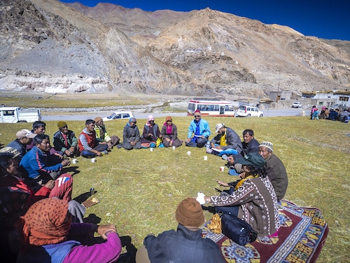 LADAKH, INDIA - SEP 18, 2014: tribal people in the mountains discuss a village issue in a meeting in Ladakh, India.
