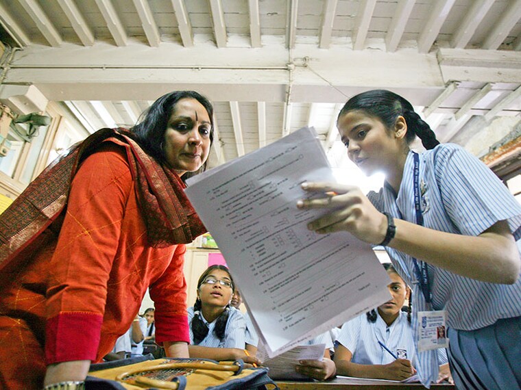 MUMBAI, INDIA - FEBRUARY 5, 2009: Education - Classroom - School Students  Girls  Vinodini Lulla interacting with students at Little flower of Jesus school in Mumbai on Thursday. (Photo by Anshuman Poyrekar/Hindustan Times via Getty Images)