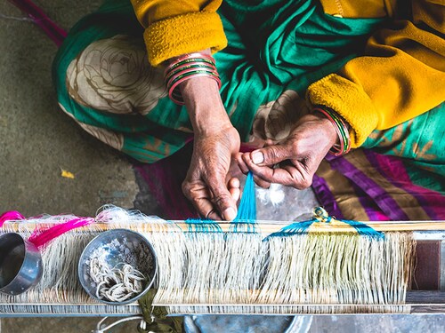 Pochampally,Telanagana/India-Feb 8 2020: Days of sheer hardwork, concentration and patience through several stages completes a saree of Ikkat genre-a famous class of saree in South India.