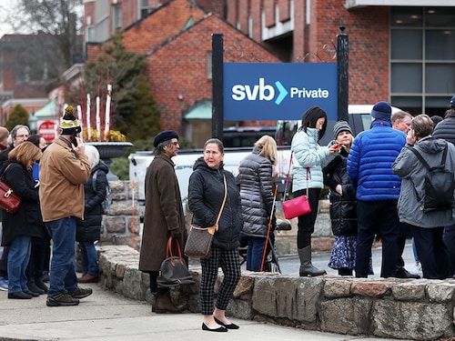 Wellesley, MA - March 13: Bank customers line up outside Silicon Valley Bank following its collapse. (Photo by David L. Ryan/The Boston Globe via Getty Images)
