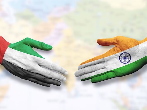 United Arab Emirates and India - Flag handshake symbolizing partnership and cooperation
