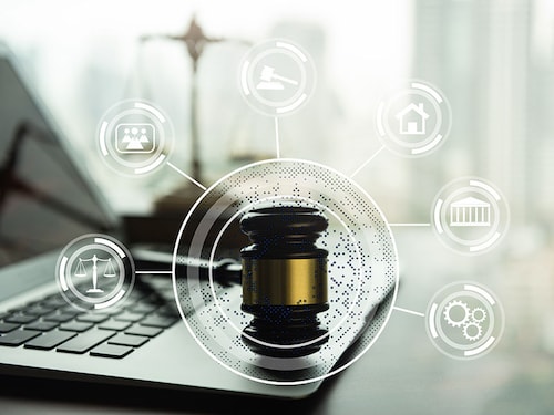 justice legal computer concept. judge gavel and computer on lawyer table with law