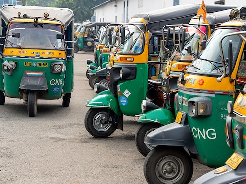 Vijayawada, INDIA -October 31, 2022 : Many CNG based auto rikshaws at taxi stand, Share auto rickshaw is a common and most economical commute in rural India.