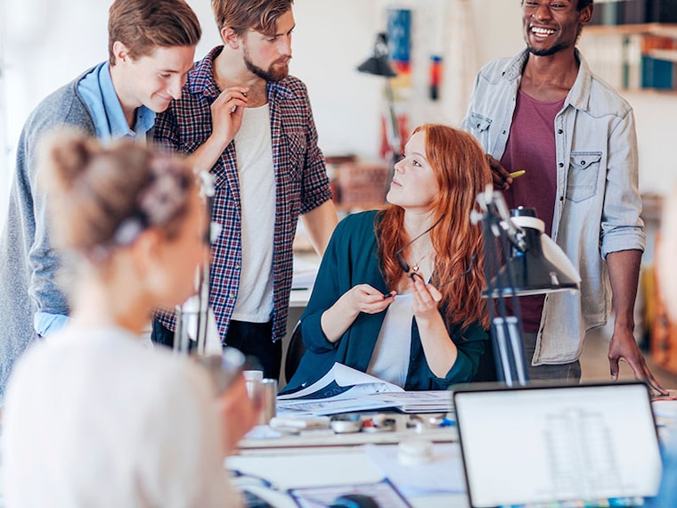 Young and diverse group of architects working together on a project together in a modern office
