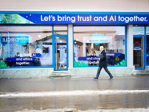 DAVOS, SWITZERLAND - 2024/01/17: A person walks past a temporary AI stall along the main Promenade which is dominated by AI this year, with Artificial Intelligence companies lining the street looking for potential investment and the chance to network with attendees at the World Economic Forum. Hosted by Klaus Schwab, the theme for the 54th World Economic Forum (WEF) is restoring trust in the future within societies and among nations. The week-long WEF event brings global leaders and industry leaders together to shape the world's future. (Photo by Andy Barton/SOPA Images/LightRocket via Getty Images)