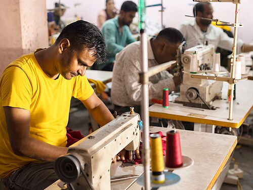 Small group of people working in textile industry