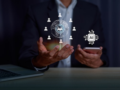 Businessman holding hologram Chat  virtual icon on smartphone intelligence Ai, Chat bot Chat with AI Artificial Intelligence, Futuristic technology, Data exchanges development.