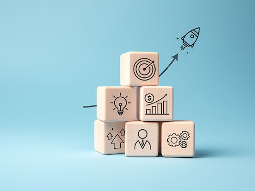 Rocket launching from wood cube with business icon, Start-up, Creativity, Big idea, Business goals management, Investment on new project to wealth, Company strategy target, Sustainable financial plan