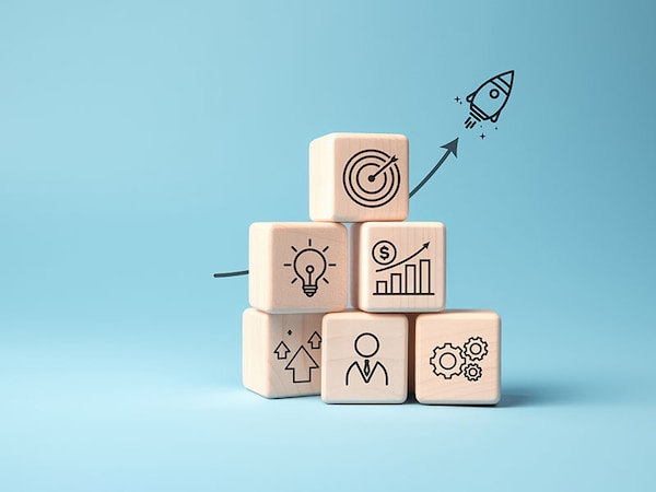 Rocket launching from wood cube with business icon, Start-up, Creativity, Big idea, Business goals management, Investment on new project to wealth, Company strategy target, Sustainable financial plan