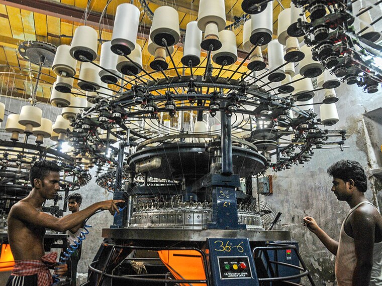 An employee is busy in front of a knitting machine in Kolkata, India, on July 05, 2024. (Photo by Debajyoti Chakraborty/NurPhoto via Getty Images)