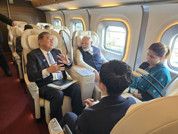 Prime Minister Narendra Modi on Saturday took a bullet train ride with his Japanese counterpart Shigeru Ishiba. The two leaders shared photos of their trip to Sendai on social media. PM Modi visited Sendai to tour key industrial facilities, including a semiconductor plant and a bullet-train coach manufacturing site. Image Credits: