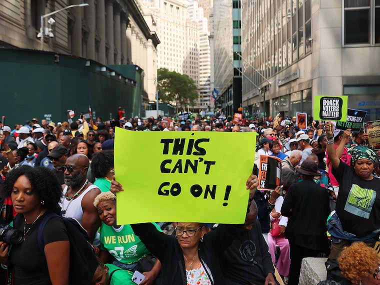 People participate in the March on Wall Street on August 28, 2025, in New York City. Rev. Al Sharpton and National Action Network (NAN) led a protest march on Wall Street, which began at Foley Square, to urge corporate America to resist the Trump administration’s campaign to roll back diversity, equity and inclusion (DEI) initiatives. The march comes on the anniversary of the Civil Rights-era March on Washington in 1963. Image: Michael M. Santiago / GETTY IMAGES NORTH AMERICA / Getty Images via AFP
