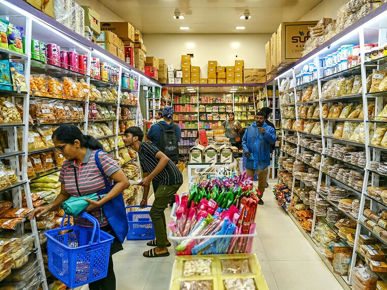 Shoppers at a department store in Mumbai on September 5, 2025. India announced GST rate cuts on essential commodities earlier this month, with the new rates set to take effect on September 22. Image: Indranil Mukherjee / AFP