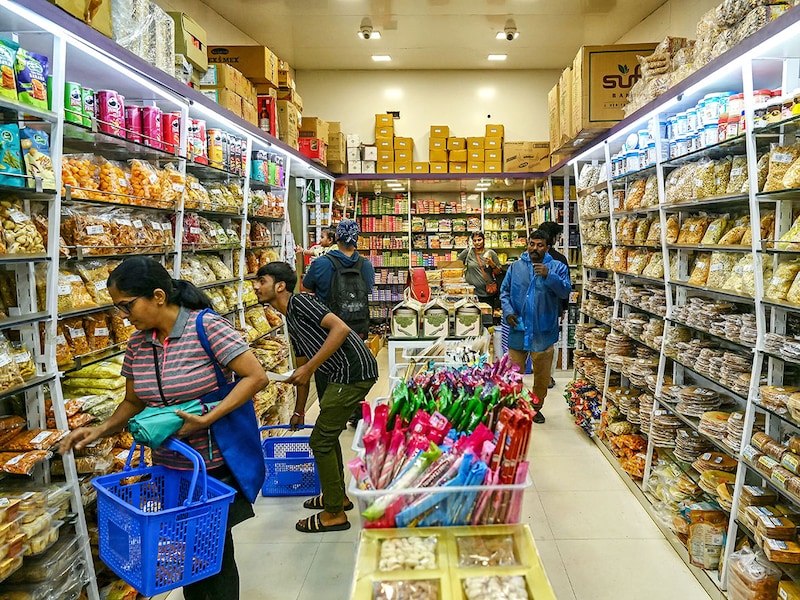 Shoppers at a department store in Mumbai on September 5, 2025. India announced GST rate cuts on essential commodities earlier this month, with the new rates set to take effect on September 22. Image: Indranil Mukherjee / AFP