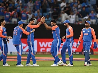 India's players celebrate after taking the wicket of Pakistan's Saim Ayub during the Asia Cup 2025 Twenty20 international cricket match between India and Pakistan at the Dubai International Stadium in Dubai on September 14, 2025.
