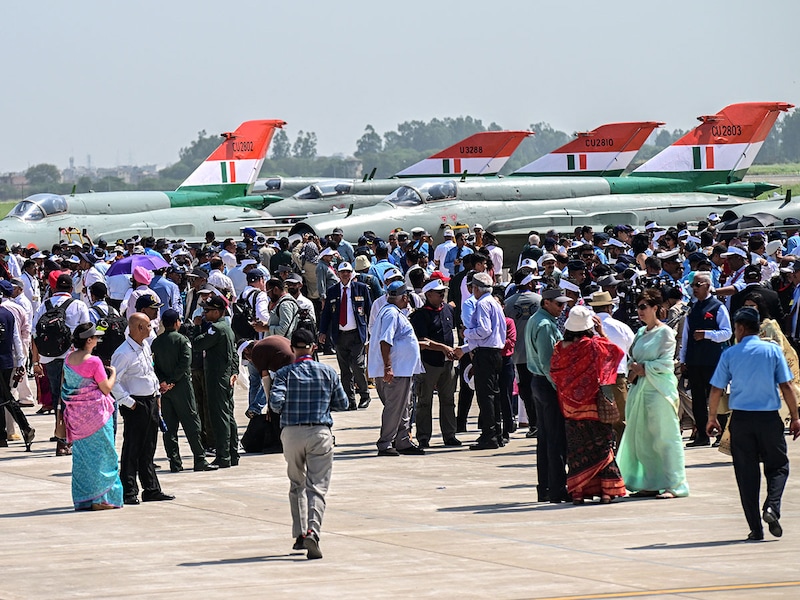 People gather to attend the farewell ceremony of India's MiG-21 fighter jets at the Chandigarh Air Force Station in Chandigarh on September 26, 2025. India's Russian-built MiG-21s flew for the final time on September 26, marking the end of an era for the country's first supersonic fighter jet — lauded for its valour but tarnished by a legacy of some 400 crashes. Image: AFP