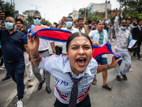 A young demonstrator shouts slogans during a protest outside the Parliament in Kathmandu on September 8, 2025. Nepal police opened fire, killing at least 17 people as thousands of young protesters took to the streets of Kathmandu demanding the government lift a social media ban and tackle corruption. 
Image: Prabin Ranabhat / AFP