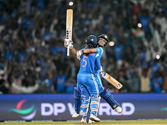 India's Jemimah Rodrigues (front) and Amanjot Kaur celebrate their team's win at the end of the ICC Women's Cricket World Cup 2025 one-day international (ODI) semi-final match between India and Australia at the DY Patil Stadium in Navi Mumbai on October 30, 2025. Photo by Punit PARANJPE / AFP