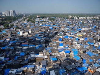 View of Mata Ramabai Ambedkar Nagar slums on October 14, 2025 in Mumbai, India. Maharashtra Chief Minister Devendra Fadnavis, along with Deputy Chief Ministers Eknath Shinde and Ajit Pawar conducted official ceremony (Bhoomipujan) for the redevelopment of Mata Ramabai Ambedkar Nagar and Kamaraj Nagar, marking the start of 4,345 new homes under Phase 1 of a major slum rehabilitation project in city.
Image: Satish Bate/Hindustan Times via Getty Images