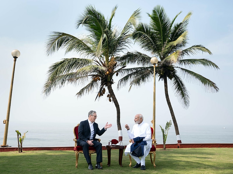 UK Prime Minister Sir Keir Starmer and Prime Minister of India, Narendra Modi, walk in the gardens of Raj Bhavan, the official residence of the governor of Maharashtra where the two leaders later held a bilateral meeting and issued press statements on October 9, 2025 in Mumbai, India. Prime Minister Keir Starmer is in India along with representatives from British businesses, universities, and cultural institutions, to promote the free trade agreement signed between the UK and India in July.