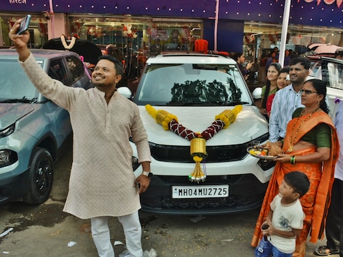 Customers throng a car showroom to purchase new cars on Dhanteras this Diwali on October 18, 2025 in Mumbai, India.
Photo by Praful Gangurde/HT via Getty Images Customers throng a car showroom to purchase new cars on Dhanteras this Diwali on October 18, 2025 in Mumbai, India.
Photo by Praful Gangurde/HT via Getty Images