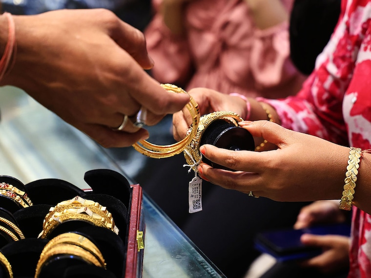 Customers purchase gold and silver ornaments from a jewelry showroom to mark the auspicious Diwali festival in Jaipur, Rajasthan, India, on October 19, 2025. 
Image: Vishal Bhatnagar/NurPhoto via Getty Images 

