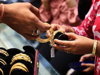 Customers purchase gold and silver ornaments from a jewelry showroom to mark the auspicious Diwali festival in Jaipur, Rajasthan, India, on October 19, 2025. 
Image: Vishal Bhatnagar/NurPhoto via Getty Images