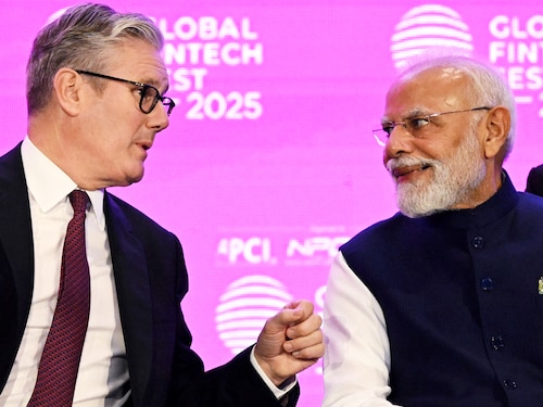 Britain's Prime Minister Keir Starmer interacts with his Indian counterpart Narendra Modi during the Global Fintech Fest at the Jio World Convention Centre in Mumbai on October 9, 2025. Britain's Prime Minister Keir Starmer interacts with his Indian counterpart Narendra Modi during the Global Fintech Fest at the Jio World Convention Centre in Mumbai on October 9, 2025.