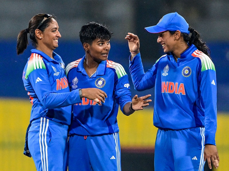 India's Kranti Goud (Centre) celebrates with captain Harmanpreet Kaur (Left) and teammate Smriti Mandhana after taking the wicket of Pakistan's Aliya Riazduring the ICC Women's Cricket World Cup 2025 one-day international (ODI) match between India and Pakistan in Colombo, on October 5, 2025. India won by 88 runs.