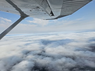Cloud seeding involves spraying chemical salt particles within clouds from an aircraft's wings, to trigger rainfall to help wash pollutants out of the air.
Image : Shutterstock
