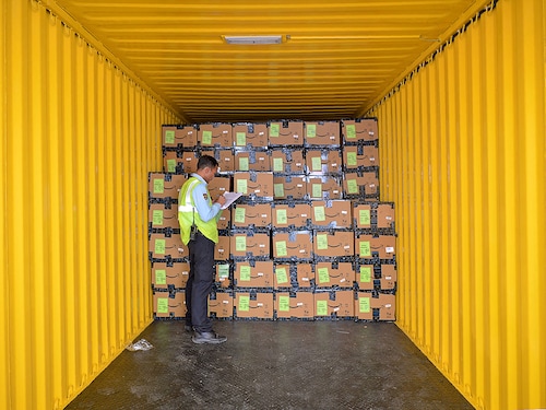 An employee of Amazon India checks products loaded in a truck before being despatched for delivery at Amazon's newly launched fulfilment centre on the outskirts of Bangalore on September 18, 2018.  
Image: Manjunath Kiran / AFP