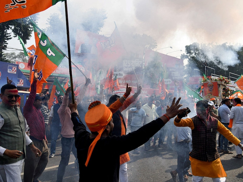 Bharatiya Janata Party (BJP) supporters celebrate as early trends show the ruling National Democratic Alliance leading in the Bihar state assembly election results, in Patna, India, November 14, 2025.