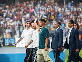 Argentina captain and football legend Lionel Messi (centre, waving his hand) with his Inter Miami colleagues Luis Suárez (in green T shirt) and Rodrigo De Paul (in a cap) at the Wankhede Stadium in Mumbai during Messi’s G.O.A.T Tour on Sunday 