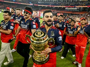 Virat Kohli (centre) takes the victory lap with his teammates after RCB won its first IPL title at the Narendra Modi Stadium in Ahmedabad on June 4
Photo by Arun Sankar / AFP 
