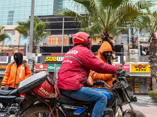 : Gig workers with Zomato and Swiggy waiting for their food delivery orders at City Centre Mall in sector 12, Dwarka, New Delhi. 31st December, 2025
Photo by : Amit Verma
