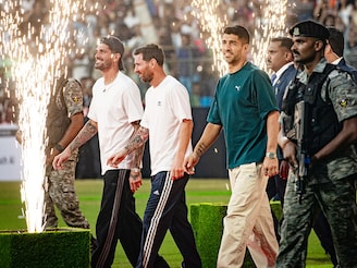 Uruguayan footballer Luis Suárez(R), Argentina's footballers Lionel Messi (C) and Rodrigo De Paul (L) with attend an event during Messi's GOAT Tour at the Wankhede Stadium in Mumbai on December 14, 2025. Uruguayan footballer Luis Suárez(R), Argentina's footballers Lionel Messi (C) and Rodrigo De Paul (L) with attend an event during Messi's GOAT Tour at the Wankhede Stadium in Mumbai on December 14, 2025.