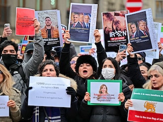 : Image caption: Protests that began on December 28 have escalated into a nationwide crackdown in Iran, with HRANA reporting 2,677 deaths and 19,097 detentions as of January 16th.  Photo by Piero CRUCIATTI / AFP
