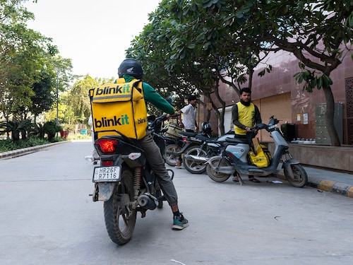 Delivery partner leaving with orders to be delivered from one of the Blinkit's dark stores in Gurugram, Haryana. Photo by Amit Verma.