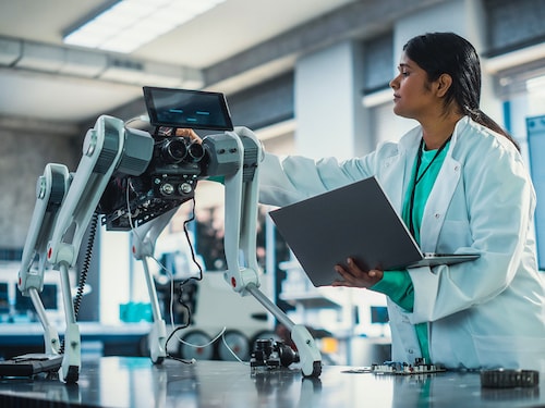 Young Indian Engineer Testing Industrial Programmable Robot Animal in a Factory Development Workshop. Photo by Gorodenkoff/Shutterstock 