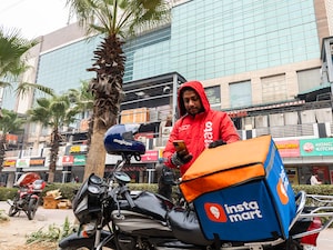 A food delivery partner with Zomato,  preparing to leave for the delivery after picking up the order he was assigned in Dwarka, New Delhi. Photo by Amit Verma