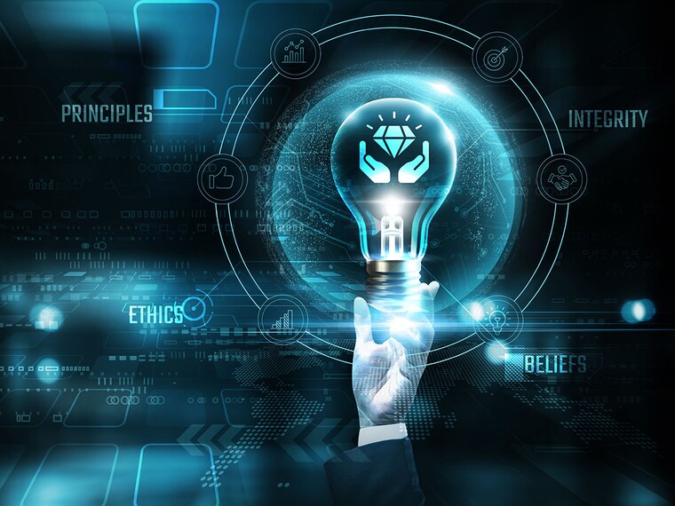 Core Values: Hands of businessman holding light bulb and core values icon with data network digital technology. Integrity, collaboration, trust, innovation.