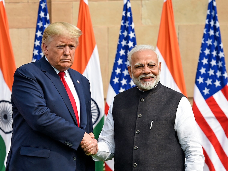 (File) India's Prime Minister Narendra Modi (R) shakes hands with US President Donald Trump.
 Photo by Prakash SINGH / AFP
