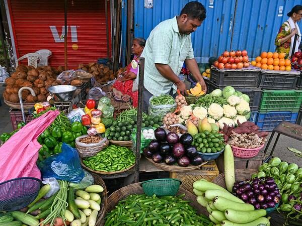 The 9.1 percentage point reduction in food’s share reflects rising incomes and diversifying consumption habits across Indian households.
Photo by Indranil Mukherjee / AFP
