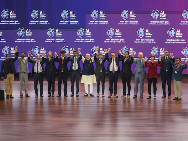 A group photograph of India's Prime Minister Narendra Modi  with global tech leaders at the India AI Impact Summit  2026 at Bharat Mandapam, in New Delhi on February 19, 2026.
Photo by Ludovic Marin / AFP
