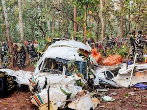 Security personnel stand near the wreckage of the Beechcraft C90 air ambulance aircraft, the night after it crashed near a forest at Chatra district, Jharkhand on February 24, 2026.
Photo by Rajesh Kumar / AFP